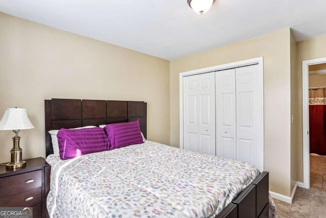 bedroom with a closet and carpet flooring