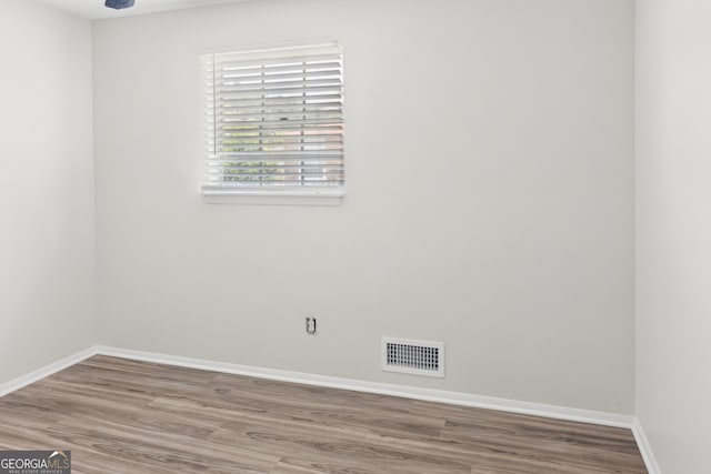 empty room featuring hardwood / wood-style flooring