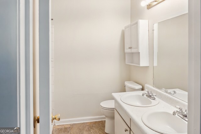 bathroom with toilet and vanity