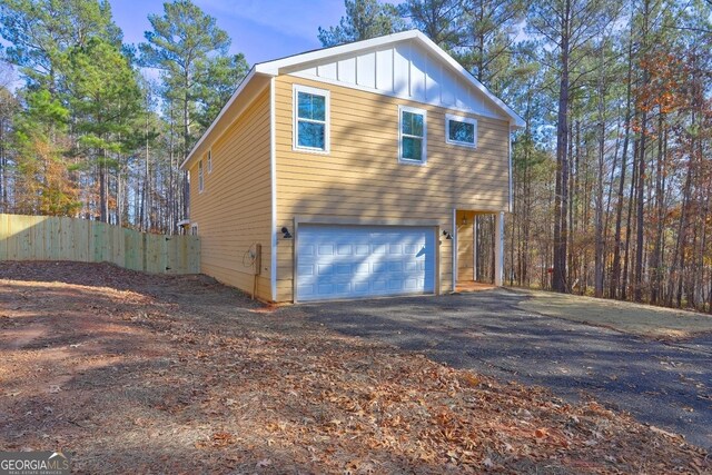 view of side of home with a garage