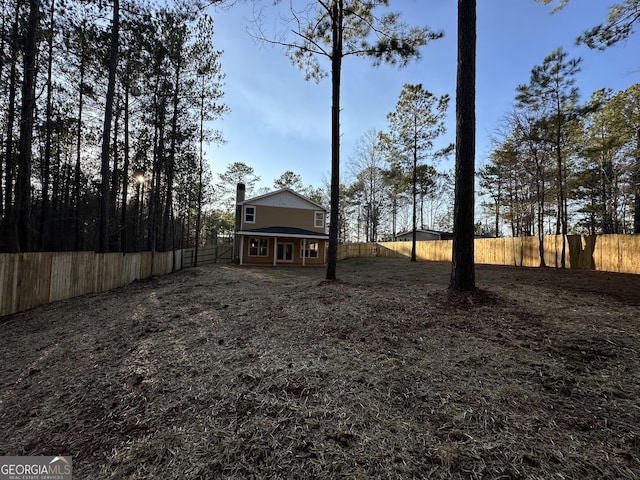 view of yard featuring a fenced backyard