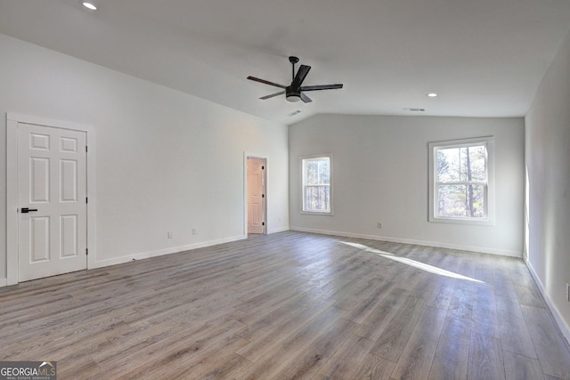 spare room featuring a wealth of natural light and light wood-style floors