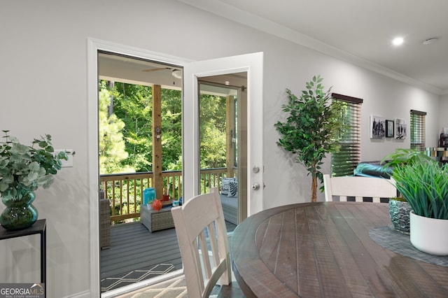 dining room featuring ceiling fan and crown molding