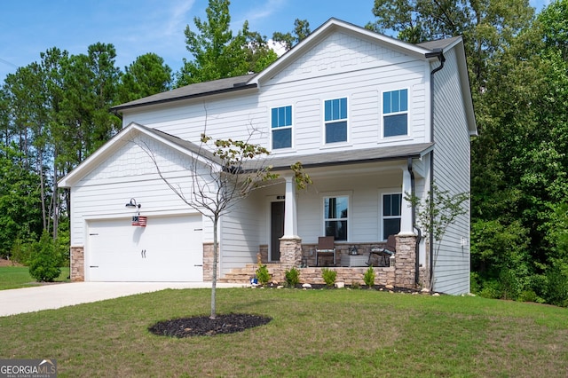 craftsman house with covered porch, a garage, and a front lawn