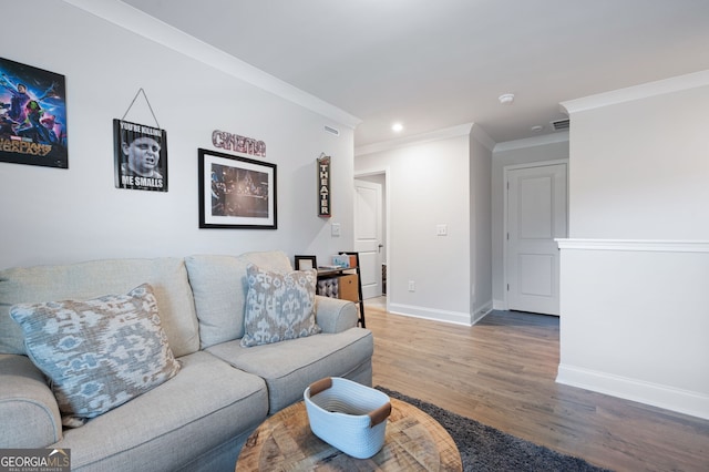 living room with hardwood / wood-style floors and ornamental molding