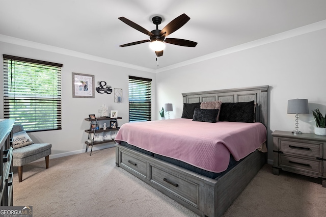 carpeted bedroom featuring multiple windows, ceiling fan, and ornamental molding