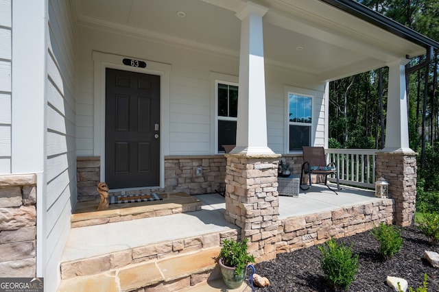 property entrance with covered porch