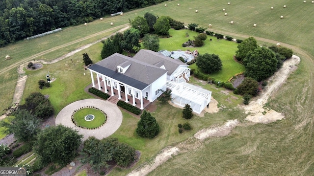 birds eye view of property featuring a rural view