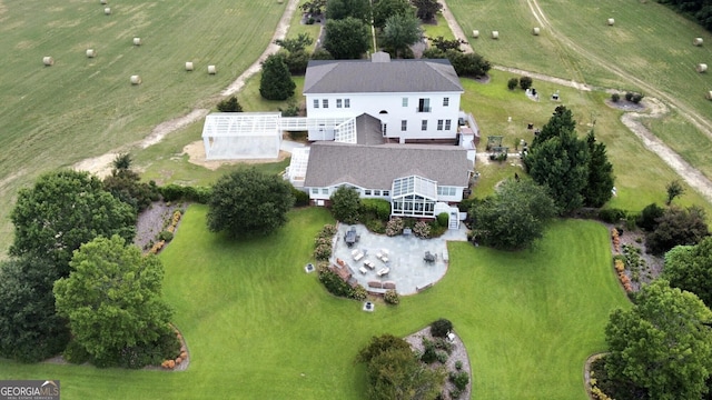 birds eye view of property featuring a rural view