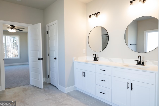 bathroom featuring tile patterned floors, ceiling fan, and vanity