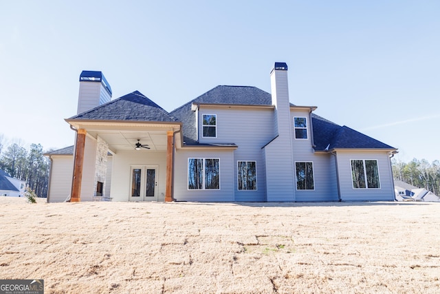 rear view of property with ceiling fan