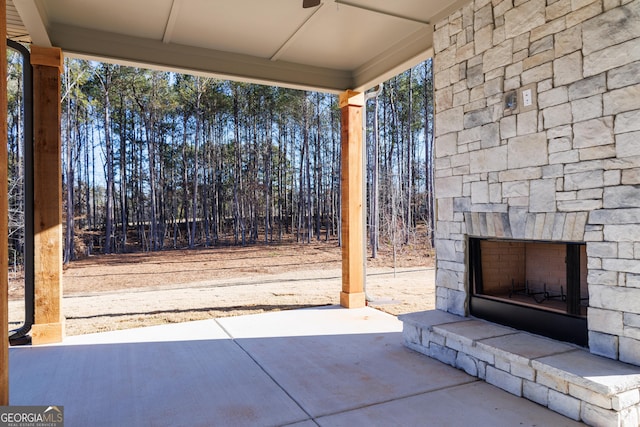 view of patio / terrace with an outdoor stone fireplace