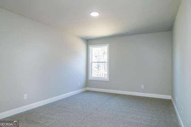 unfurnished room featuring carpet flooring