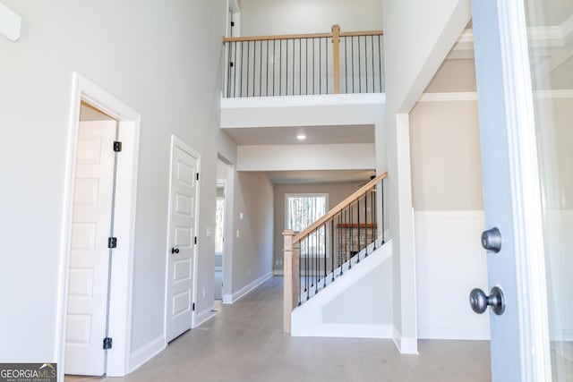 foyer entrance with a high ceiling