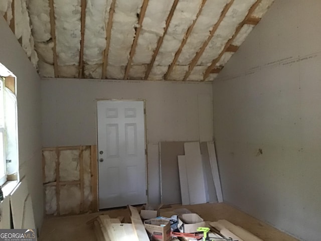 empty room with vaulted ceiling