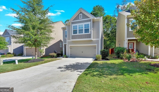 view of front of house featuring a front yard and a garage