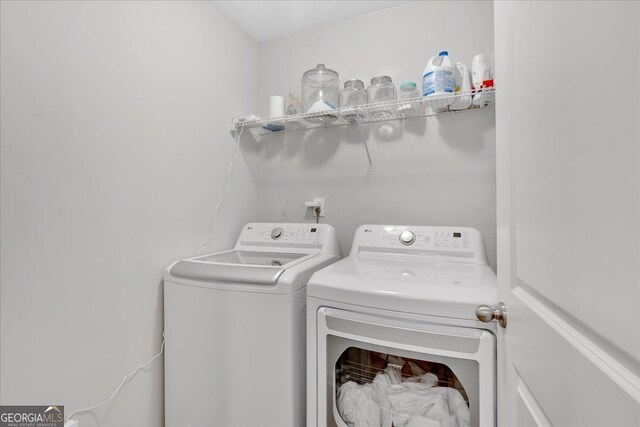 laundry area with separate washer and dryer