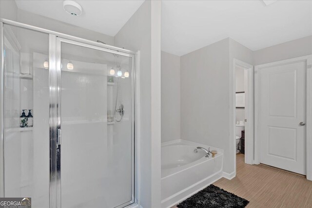 bathroom with separate shower and tub