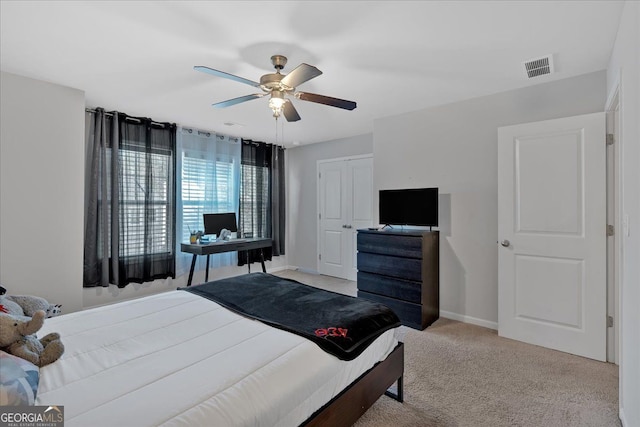 carpeted bedroom with ceiling fan