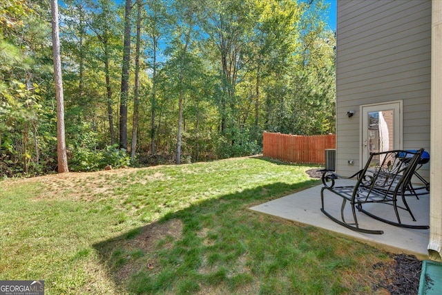 view of yard featuring cooling unit and a patio area