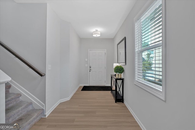 entryway with light hardwood / wood-style flooring