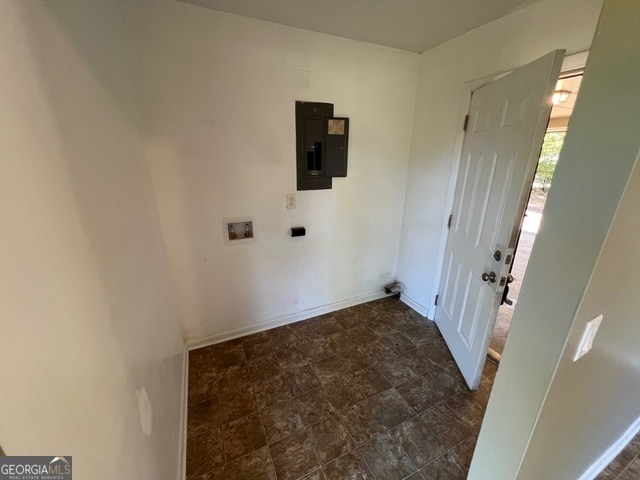 clothes washing area featuring electric panel and washer hookup