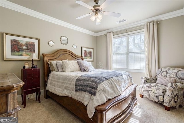 bedroom with crown molding, light carpet, and ceiling fan