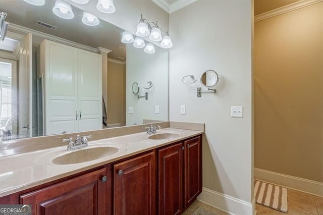 bathroom with vanity, ornamental molding, and tile patterned floors