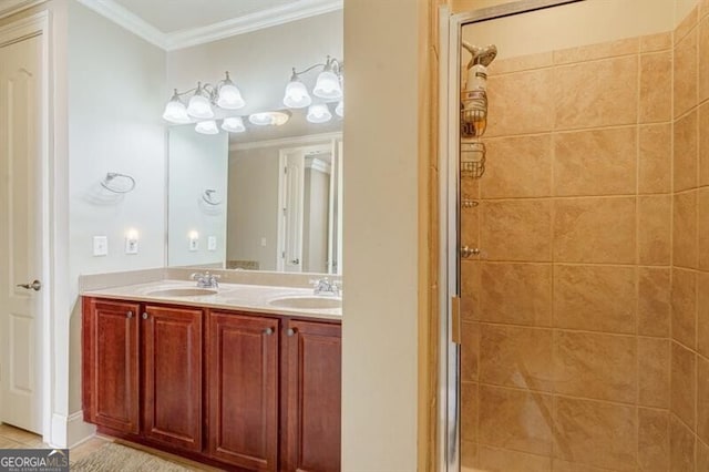 bathroom with vanity, ornamental molding, and an enclosed shower