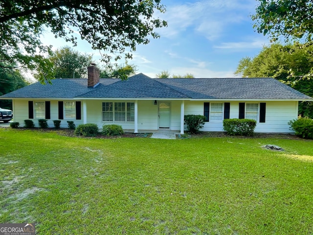 ranch-style home with a front yard