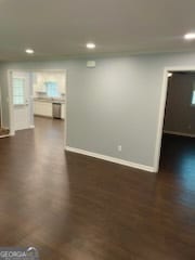 unfurnished living room with dark hardwood / wood-style floors