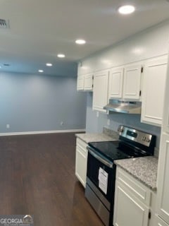 kitchen featuring stainless steel electric range, white cabinets, light stone counters, and dark hardwood / wood-style floors