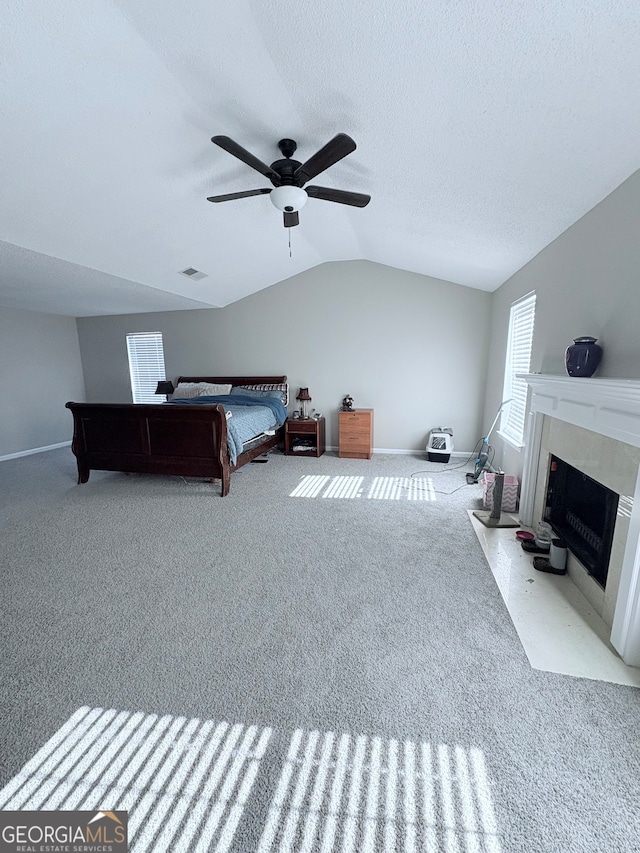 carpeted bedroom featuring vaulted ceiling and ceiling fan