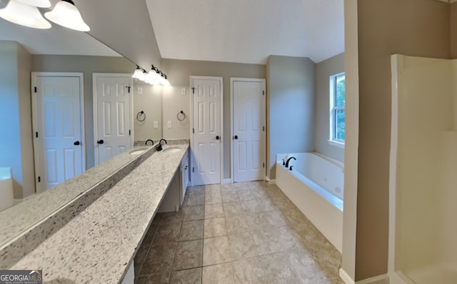 bathroom with vanity and a bathtub