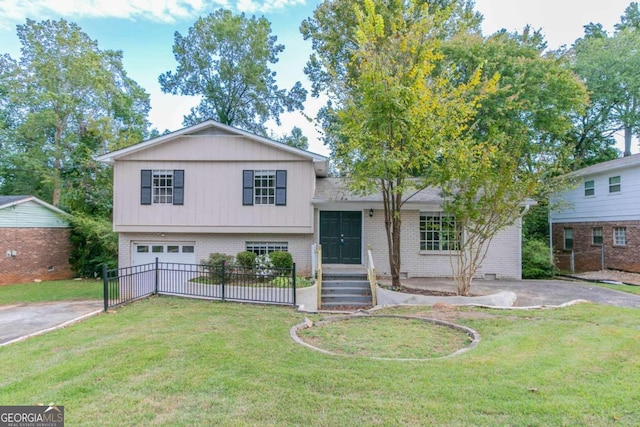 split level home featuring a front lawn and a garage