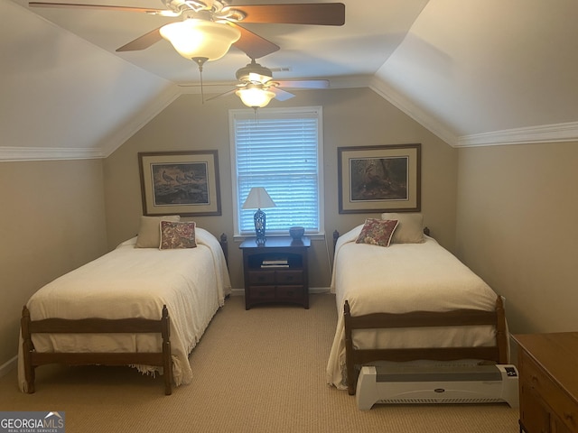 carpeted bedroom with vaulted ceiling and ceiling fan