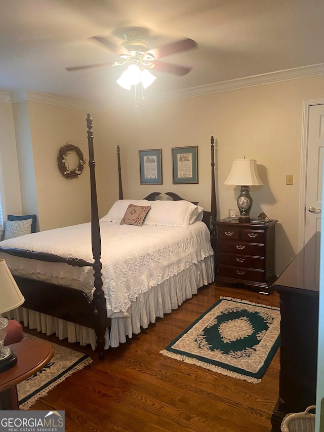 bedroom with ceiling fan, ornamental molding, and dark hardwood / wood-style flooring