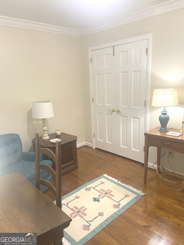 office area with ornamental molding and dark hardwood / wood-style flooring