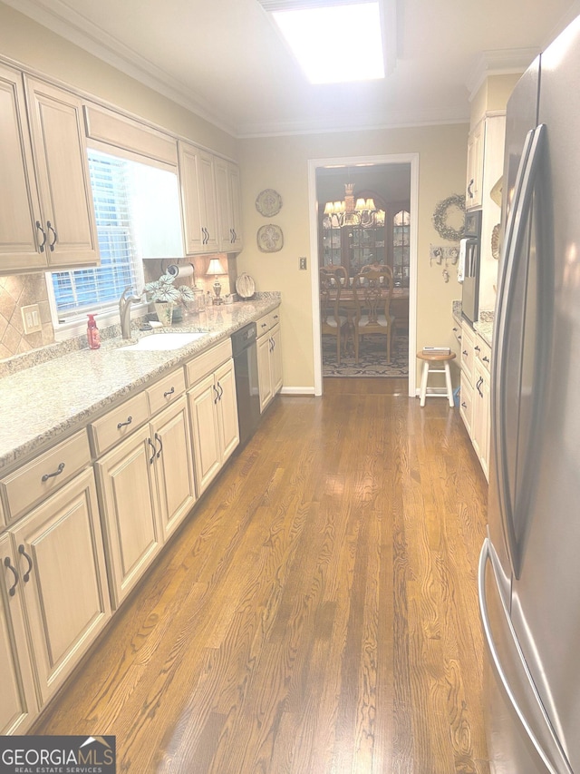 100 Valley Brook Dr SE, Rome, GA 30161 - kitchen with a sink, freestanding refrigerator, a notable chandelier, dishwashing machine, and ornamental molding