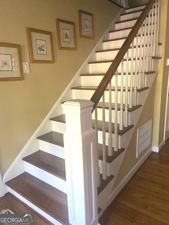 100 Valley Brook Dr SE, Rome, GA 30161 - staircase with baseboards, wood finished floors, and visible vents