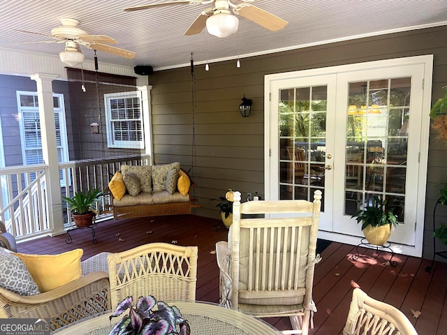 deck featuring french doors and ceiling fan