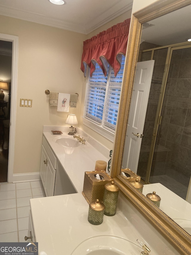 bathroom with vanity, crown molding, a shower with door, and tile patterned floors