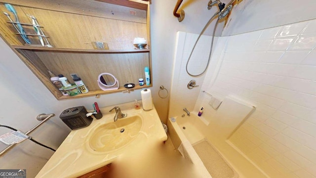 bathroom with vanity and tiled shower / bath combo