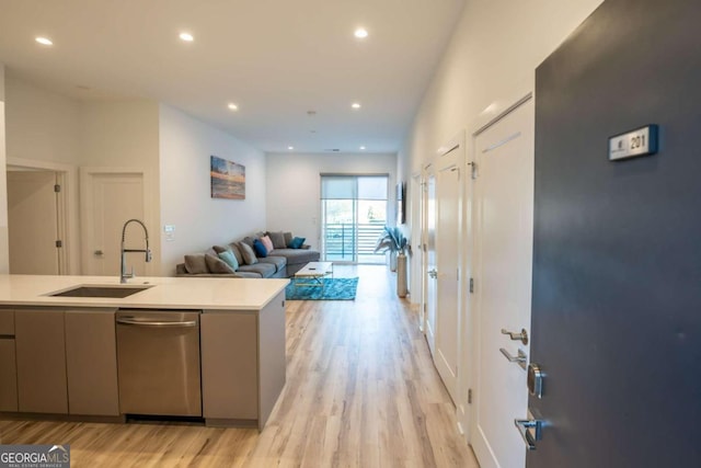 kitchen featuring sink and light wood-type flooring