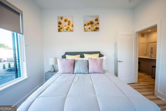 bedroom with light wood-type flooring