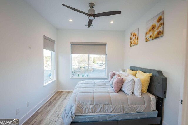 bedroom featuring light hardwood / wood-style floors and ceiling fan