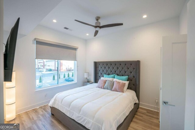 bedroom featuring ceiling fan and light hardwood / wood-style flooring