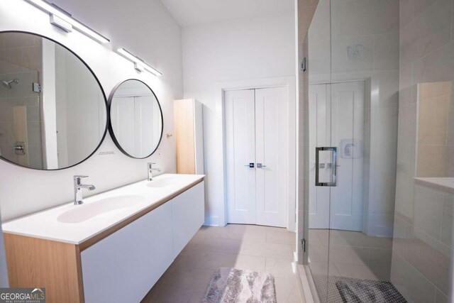 bathroom featuring vanity, tile patterned floors, and an enclosed shower