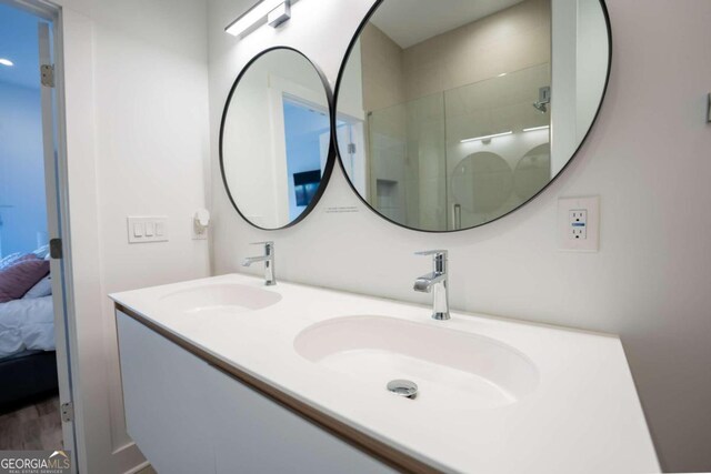 bathroom featuring vanity and walk in shower