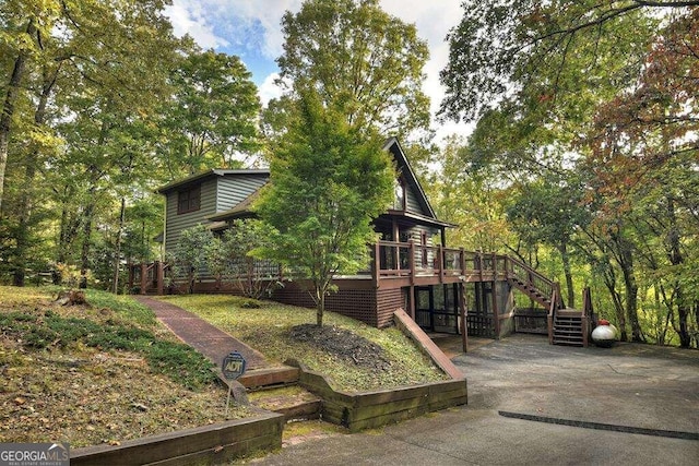 exterior space featuring a wooden deck